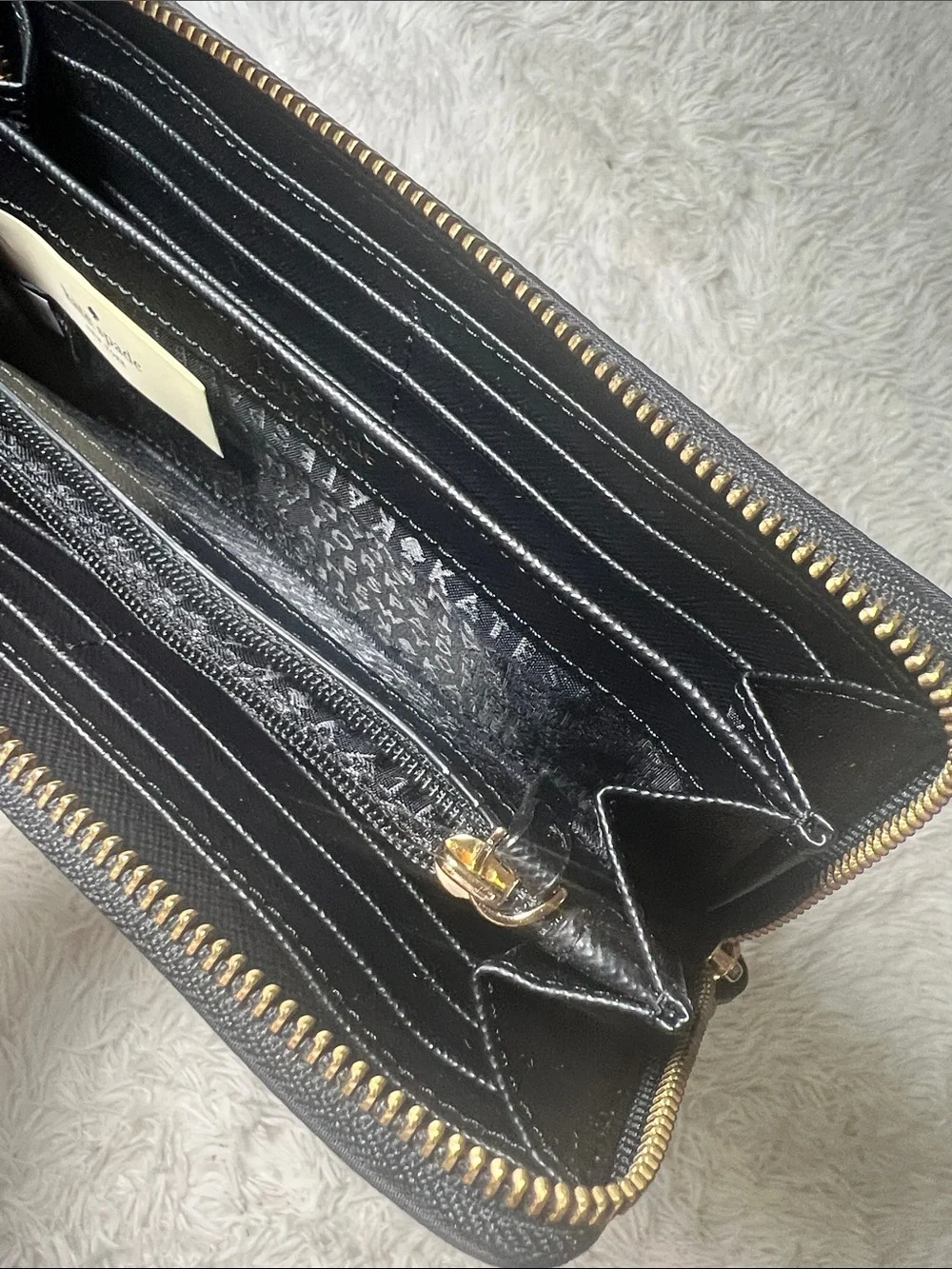kate spade Black Zip-Around Logo Plate Wallet